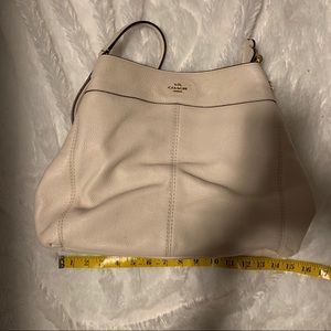 Cream colored leather Coach purse